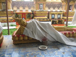 Leaning Buddha statue