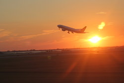 Plane starting at sunset