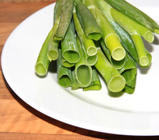 Spring onion on the white plate